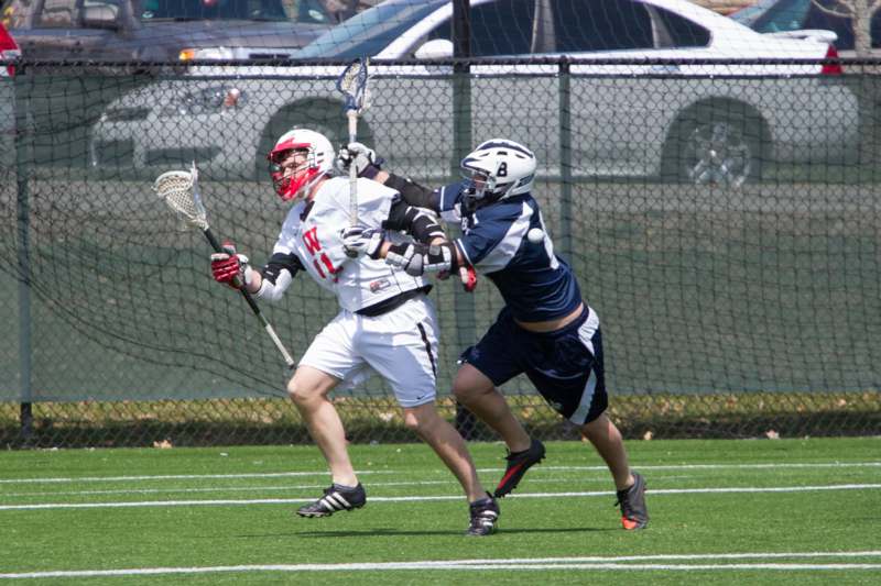 a group of people playing lacrosse