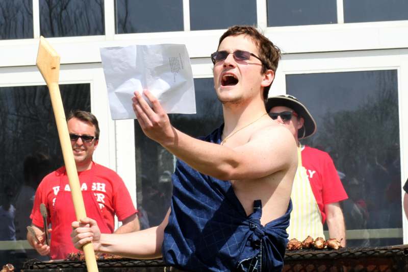 a man holding a piece of paper and holding a stick