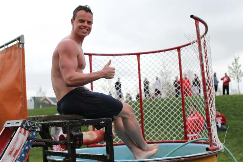 a man sitting on a trampoline