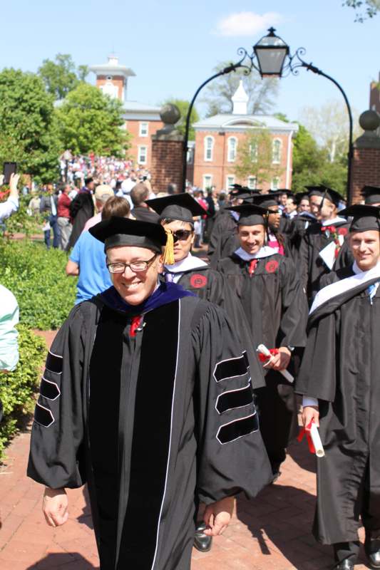 a group of people wearing graduation gowns and caps
