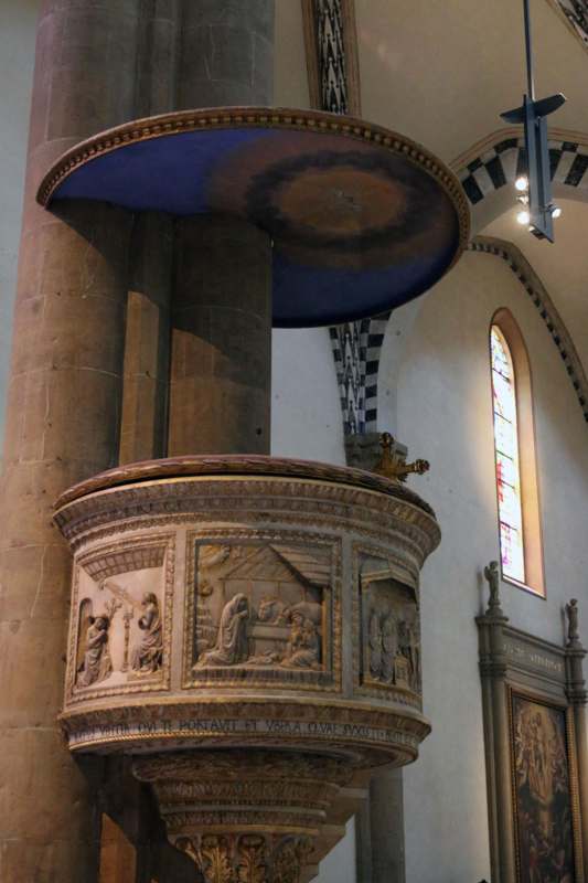 a stone pillar with a blue ceiling
