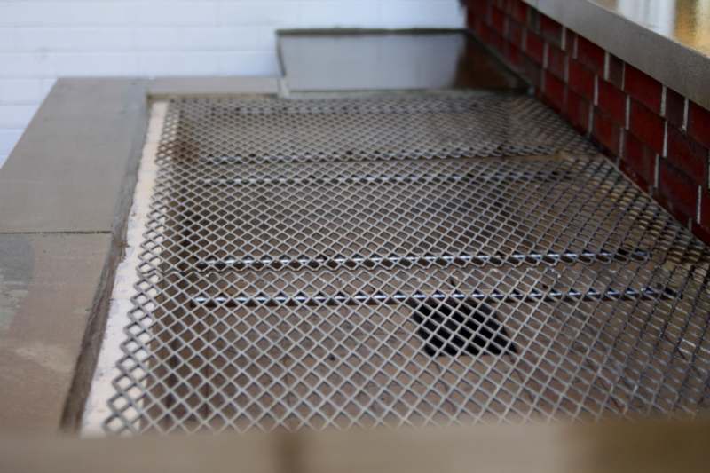a metal grate on a floor