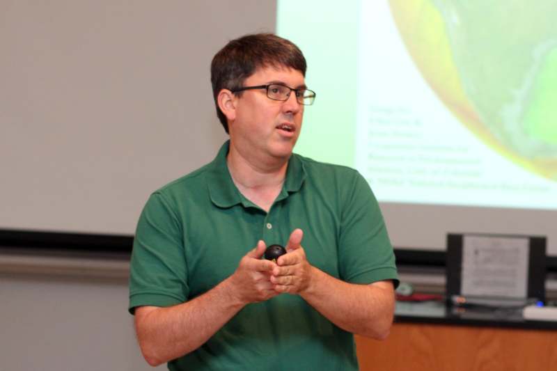 a man in a green shirt