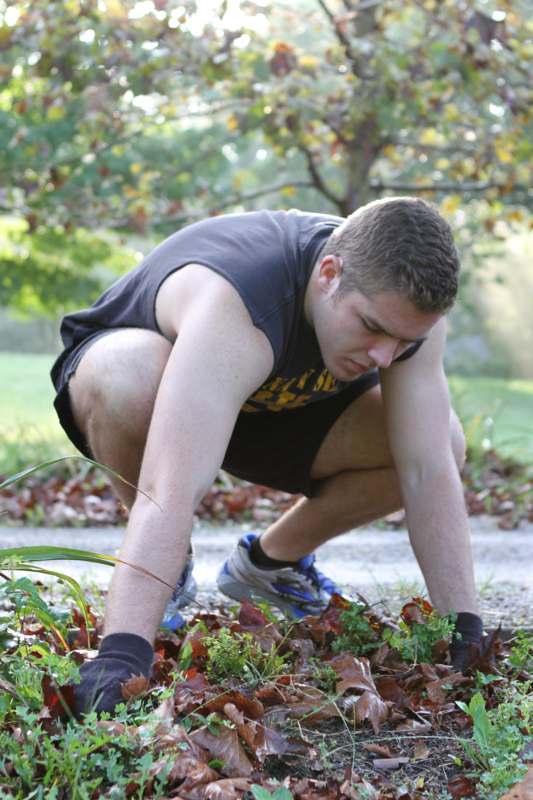 a man crouching in the ground