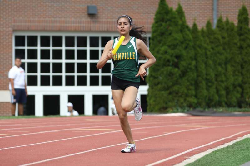 a woman running on a track