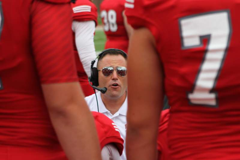 a football coach with his headphones