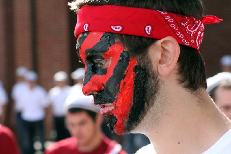 a man with a red bandana on his face