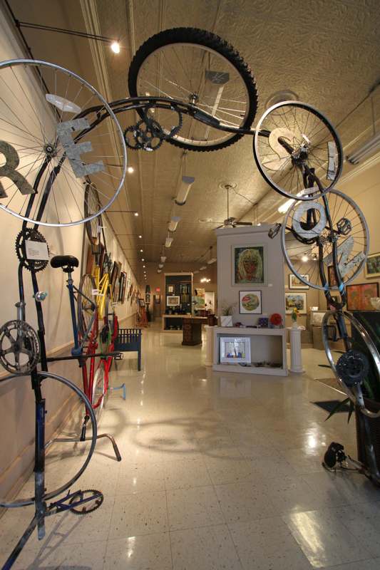 a bicycle sculpture in a room