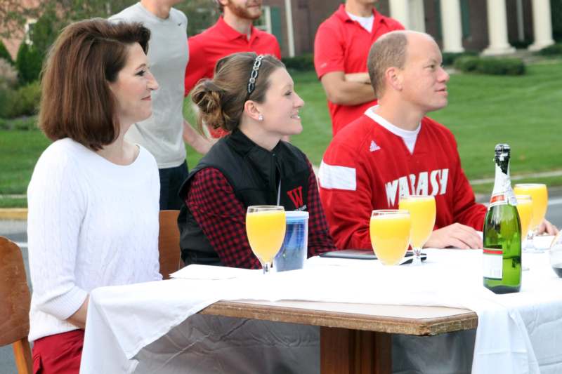 a group of people sitting at a table with drinks