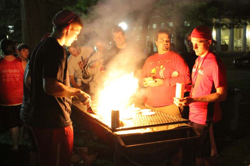 a group of people around a fire