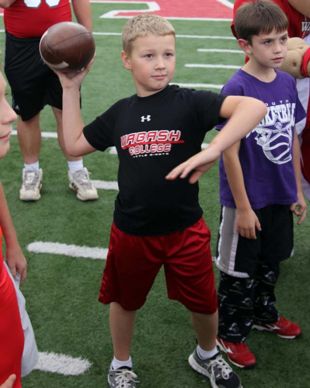 a boy holding a football