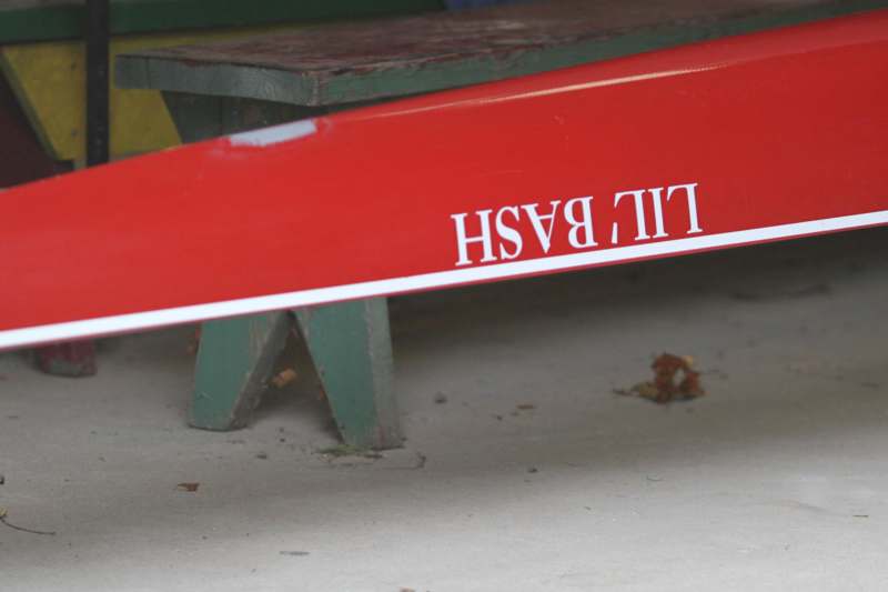 a red sign on a bench