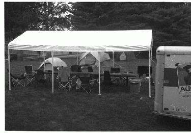 a tent with umbrellas and chairs
