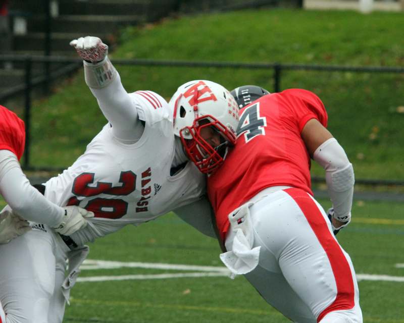 a football players fighting for the ball