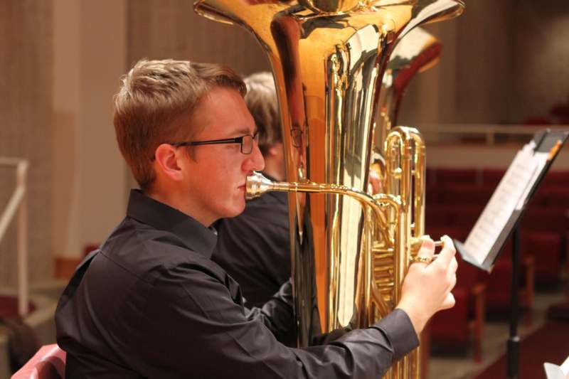 a man playing a tuba