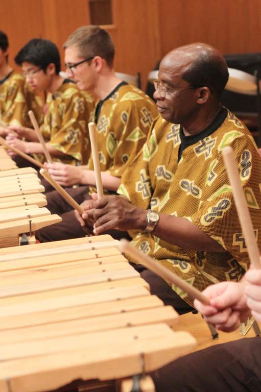 a group of men playing xylophones