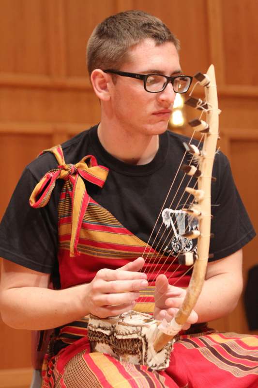 a man playing a stringed instrument
