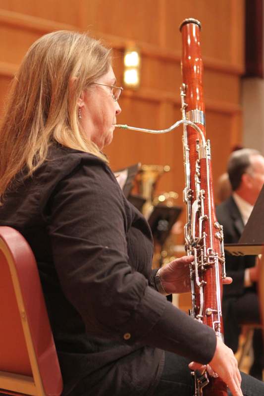 a woman playing a bassoon
