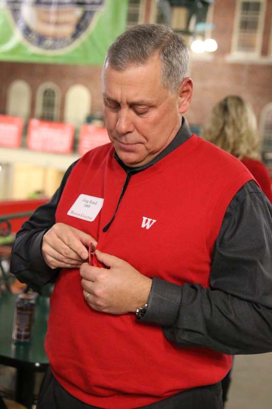 a man in a red vest