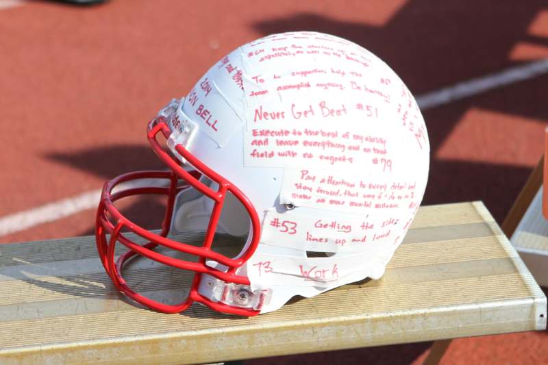 a football helmet with writing on it