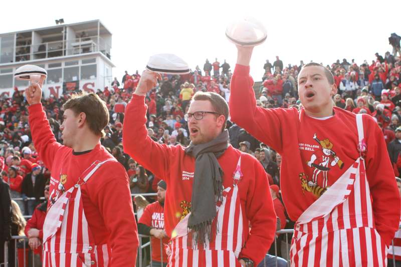 a group of men wearing matching red and white striped outfits