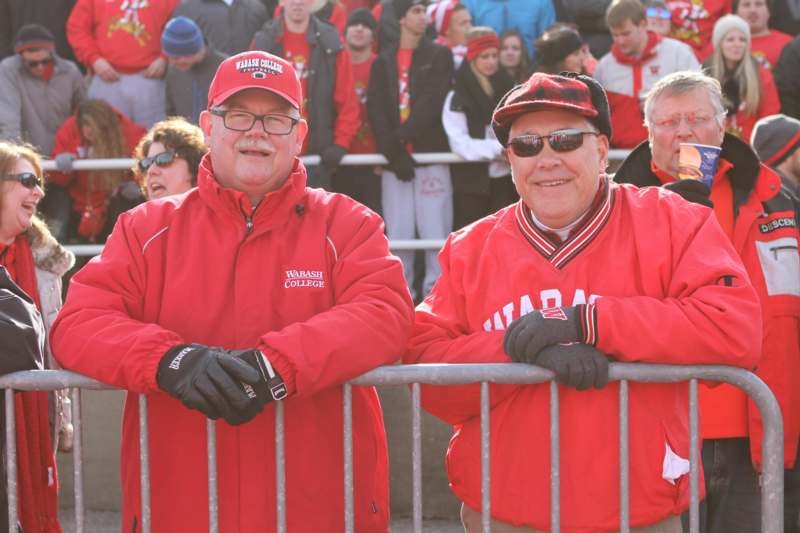 a group of men wearing red jackets and hats