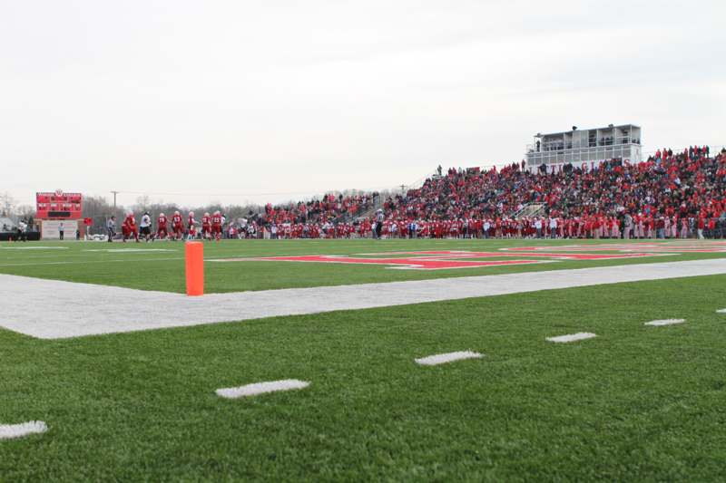 a football field with people in the stands