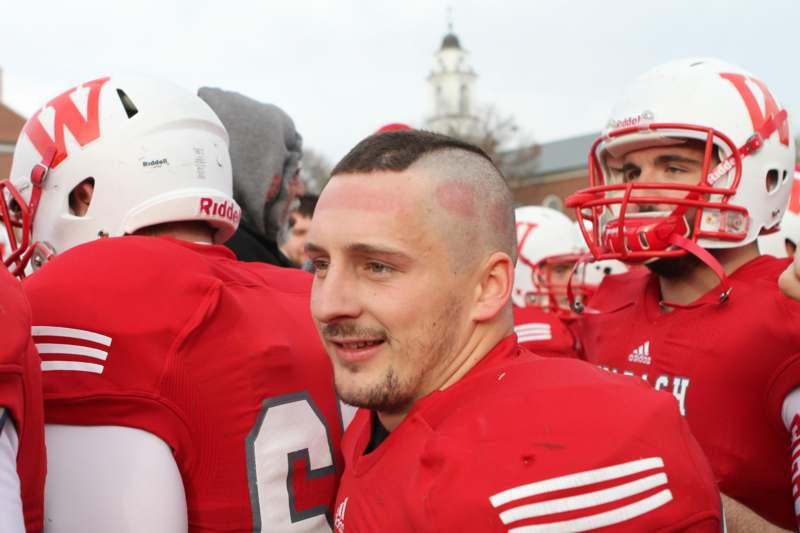 a football player with his head shaved