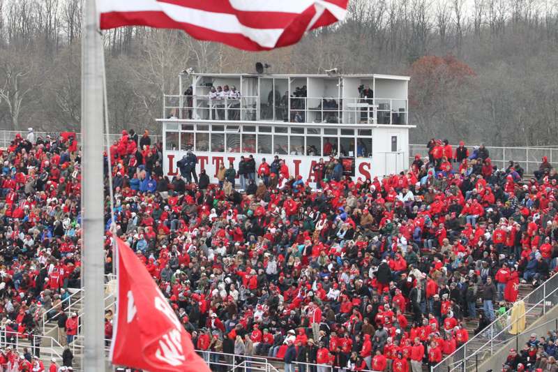 a large crowd of people in red jackets