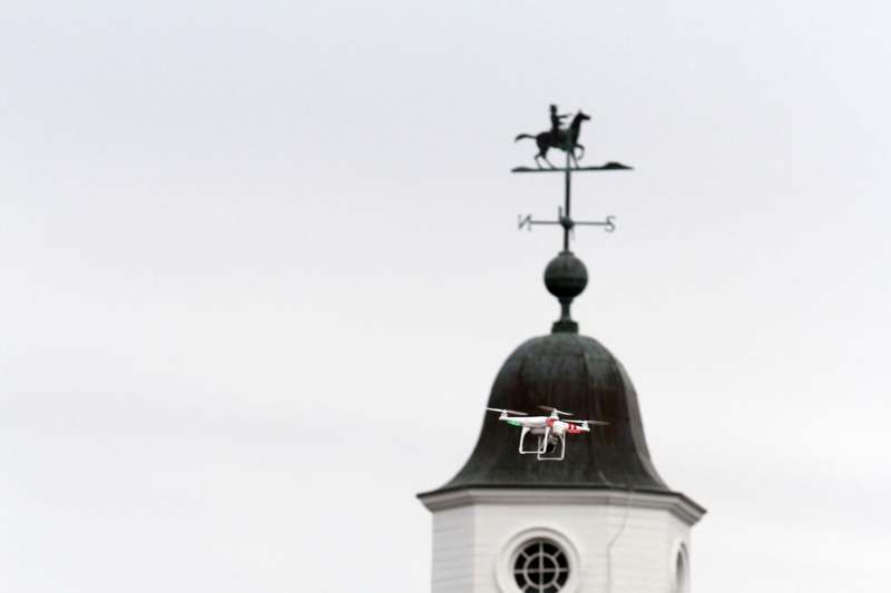 a drone flying over a building