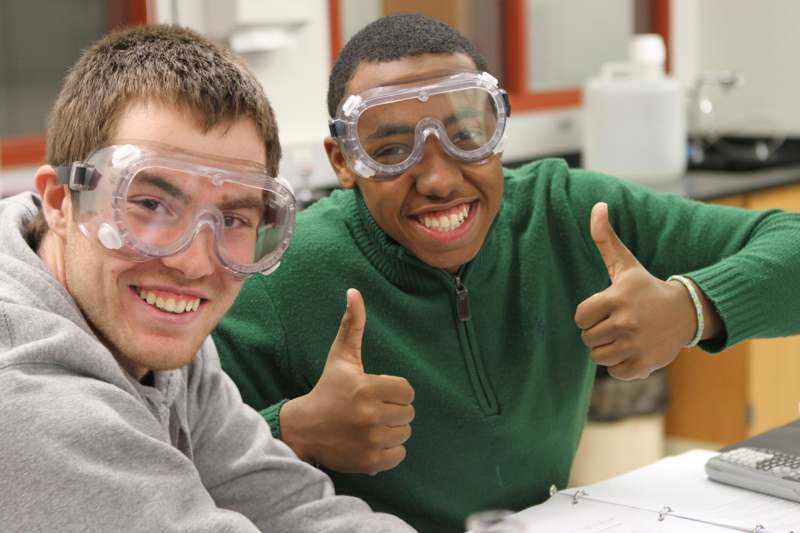 a couple of men wearing safety goggles