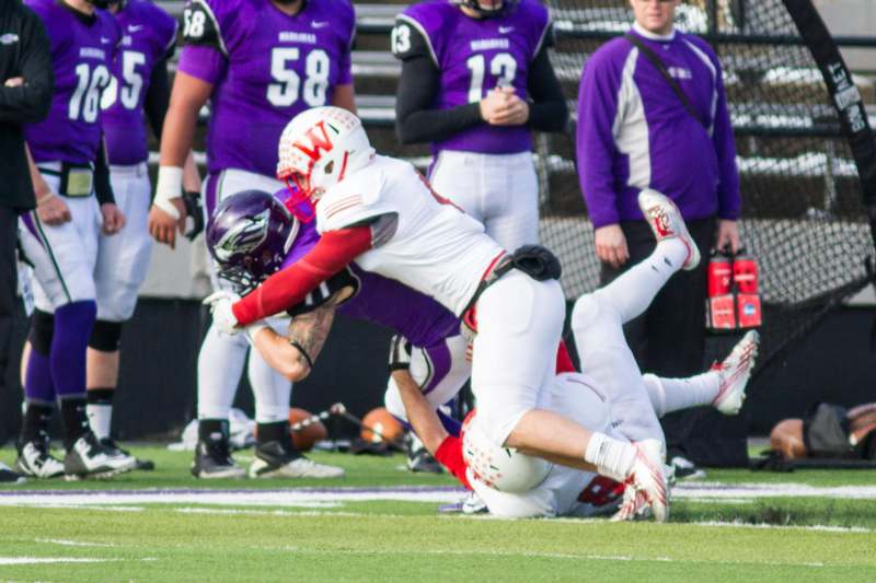 a football player falling down to the ground