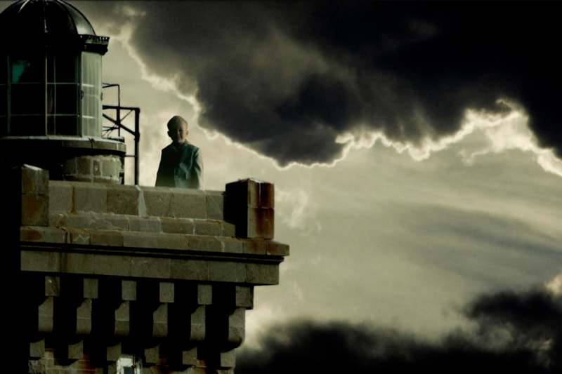 a man standing on a roof