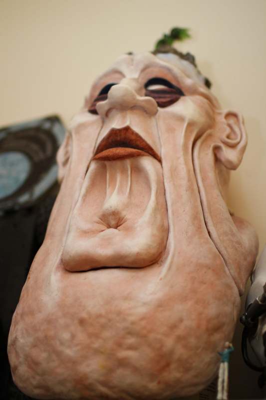 a statue of a man with a face and mouth