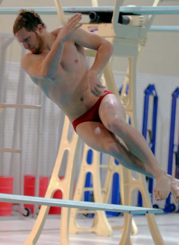 a man diving into a pool