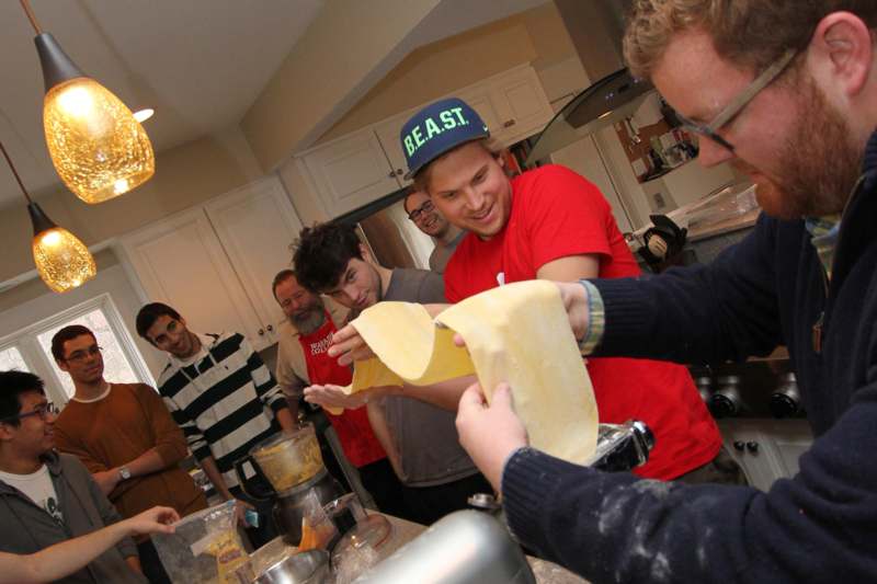 a group of people making food