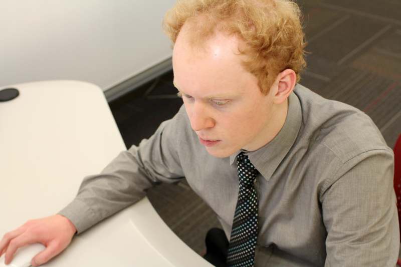 a man sitting at a desk