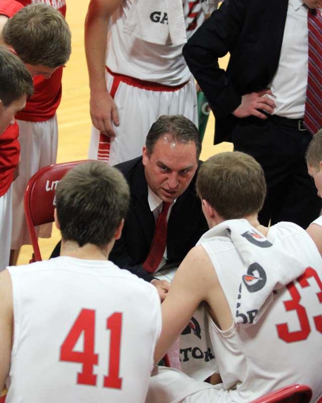 a basketball coach talking to his players