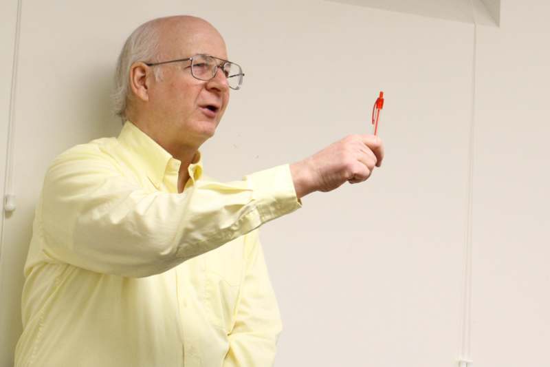 a man holding a pen