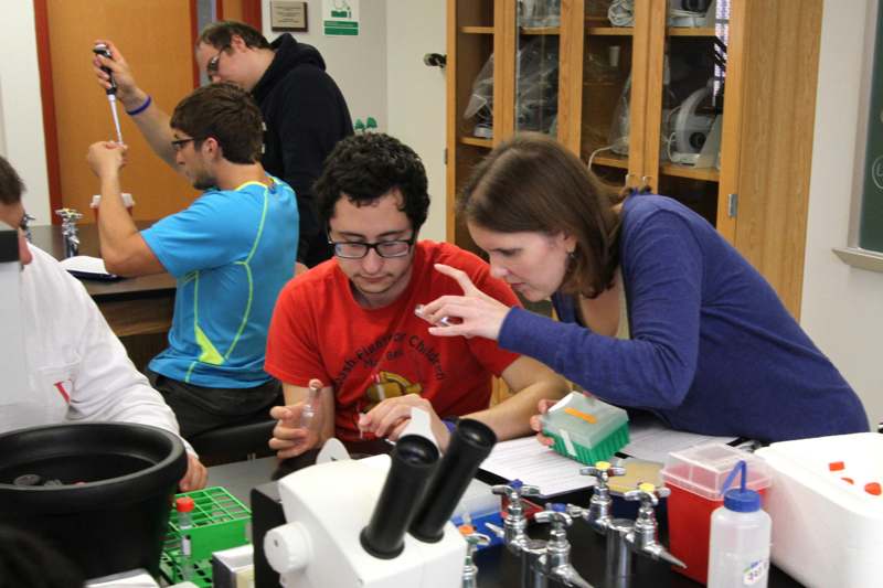 a group of people working in a lab