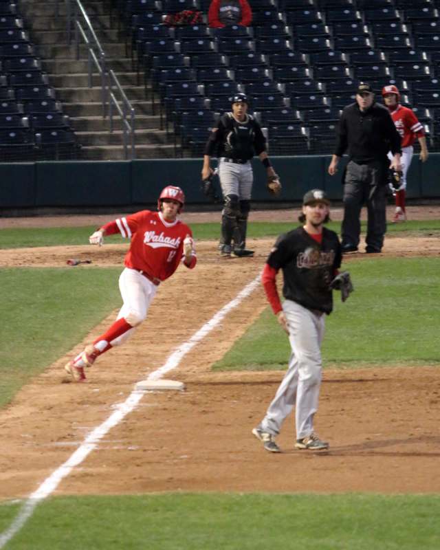 a baseball player running to first base