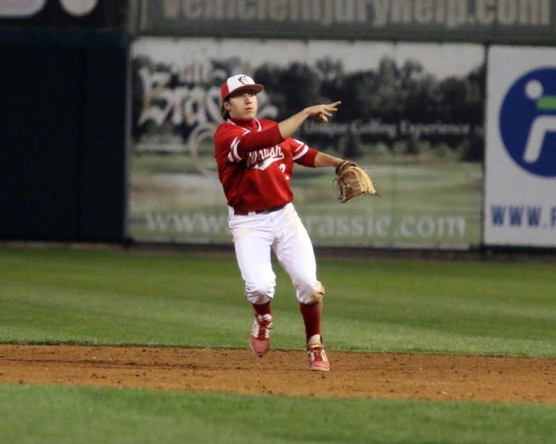 a baseball player throwing a baseball