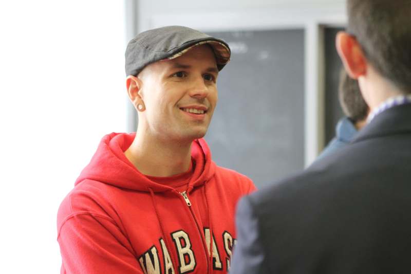 a man in a red hoodie and hat