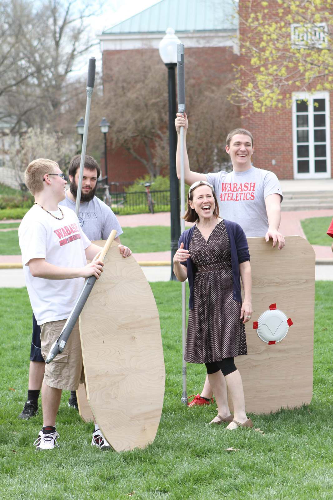 a group of people holding shields and shields