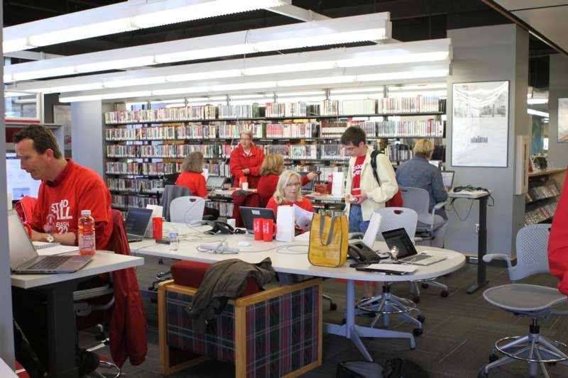 a group of people in a library