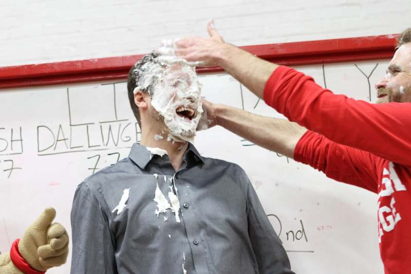 a man with whipped cream on his face