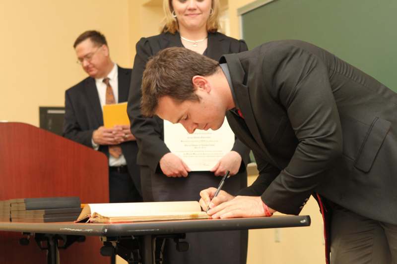 a man signing a book