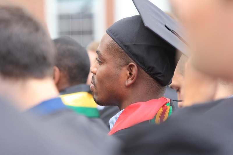 a man in a graduation cap and gown