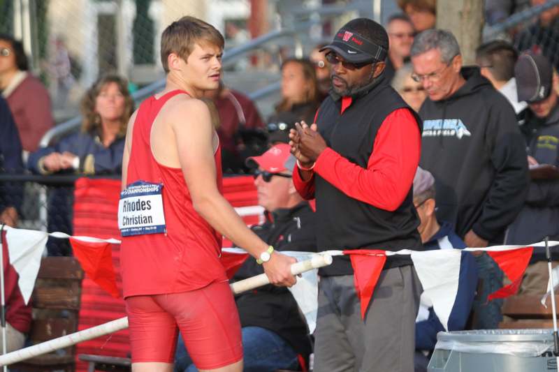 a man talking to a man in a race