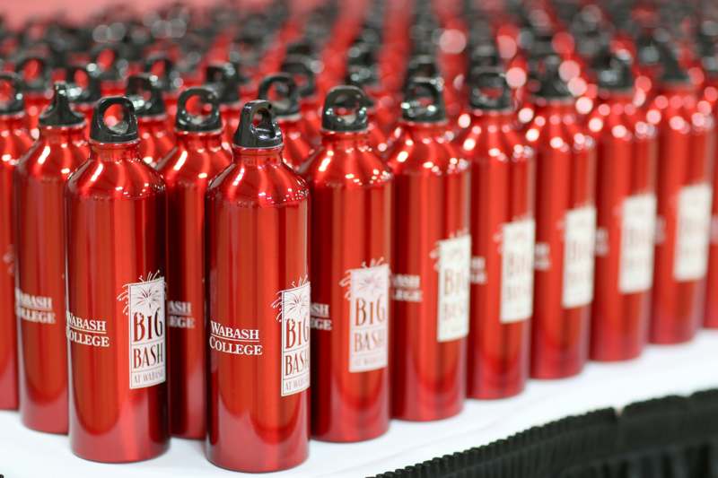 a group of red water bottles
